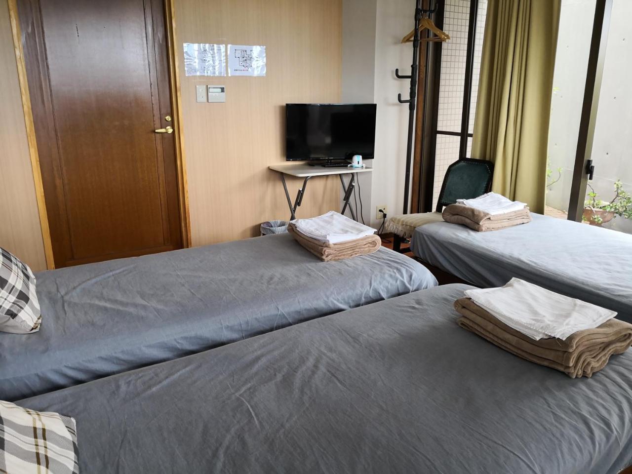 Atami Onsen Guest House Megumi Bagian luar foto